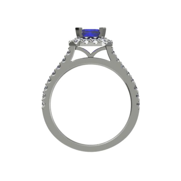 Platinum ring with emerald centre and 32 small round diamonds